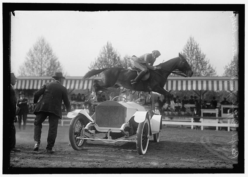 Ralph Coffin jumping horse over Sylvanus Stoke's Rolls Royce at the Society Circus 1916.